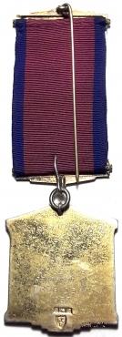 Знак Президента Ассамблеи K.O.M. (KNIGHT ORDER OF MERIT – рыцарь ордена заслуг).